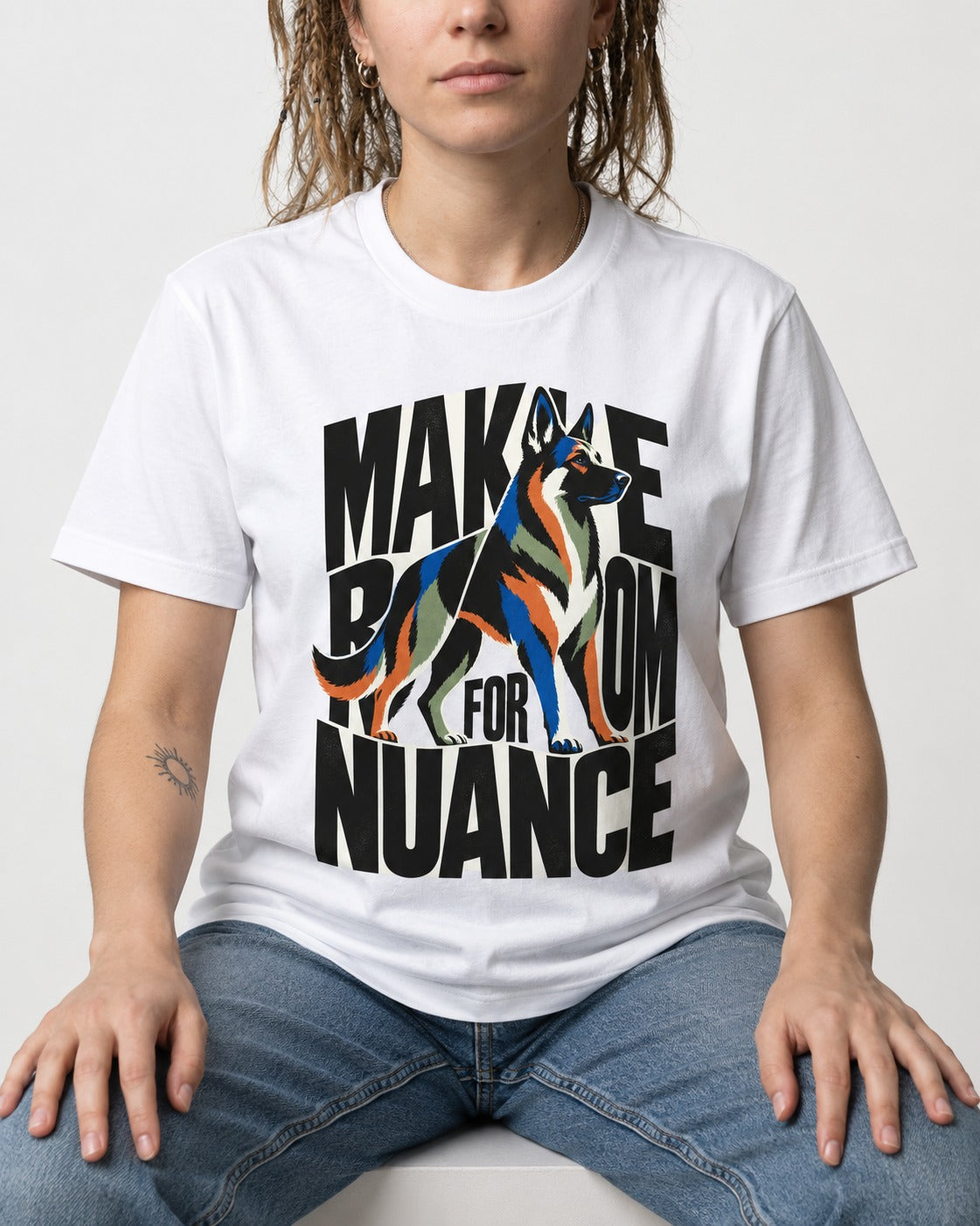 Make Room for Nuance German Shepherd Dog T-Shirt in White, worn by a seated model