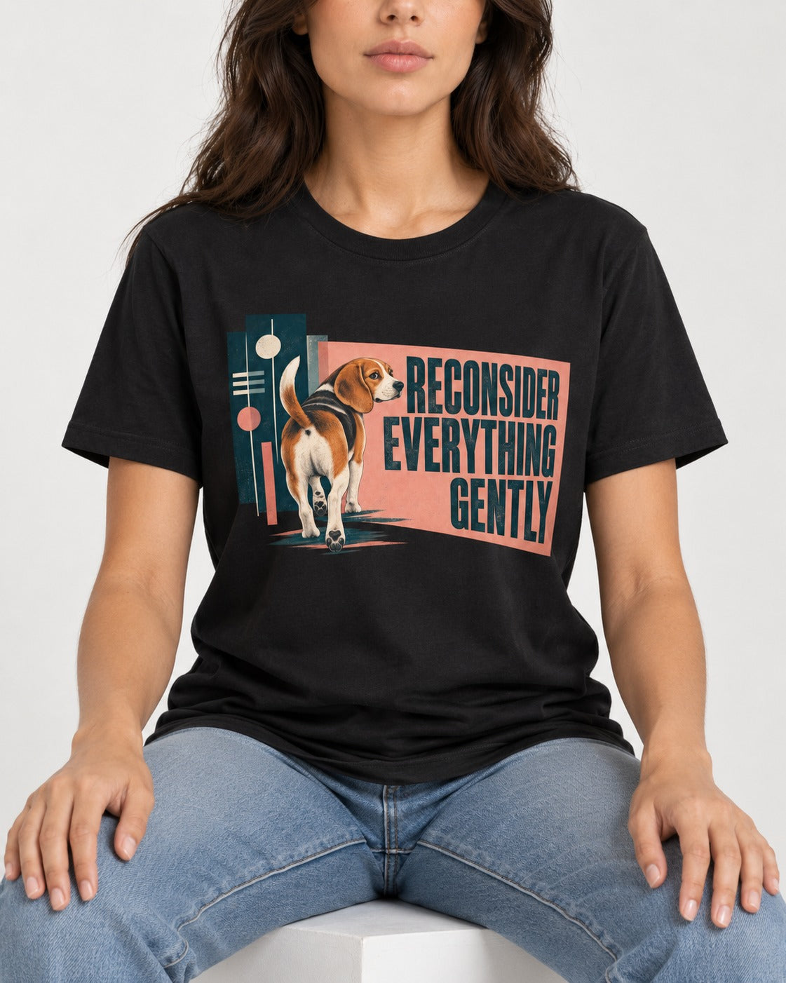 Beagle Reconsider Everything Gently Retro Graphic T-Shirt in Black, worn by a seated model
