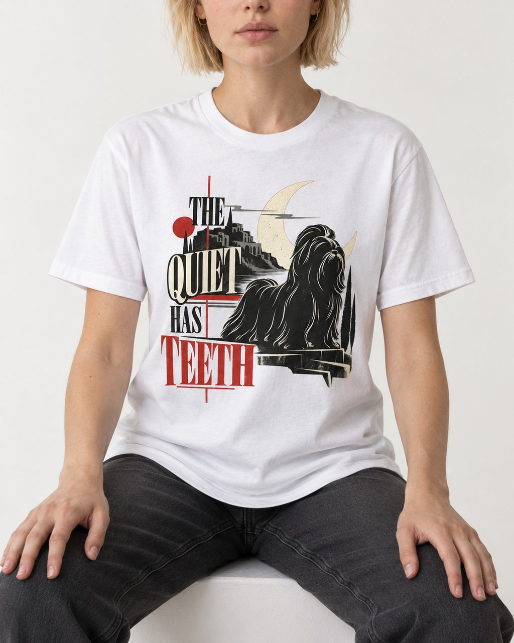 The Quiet Shih Tzu Has Teeth T-Shirt in White, worn by a seated model