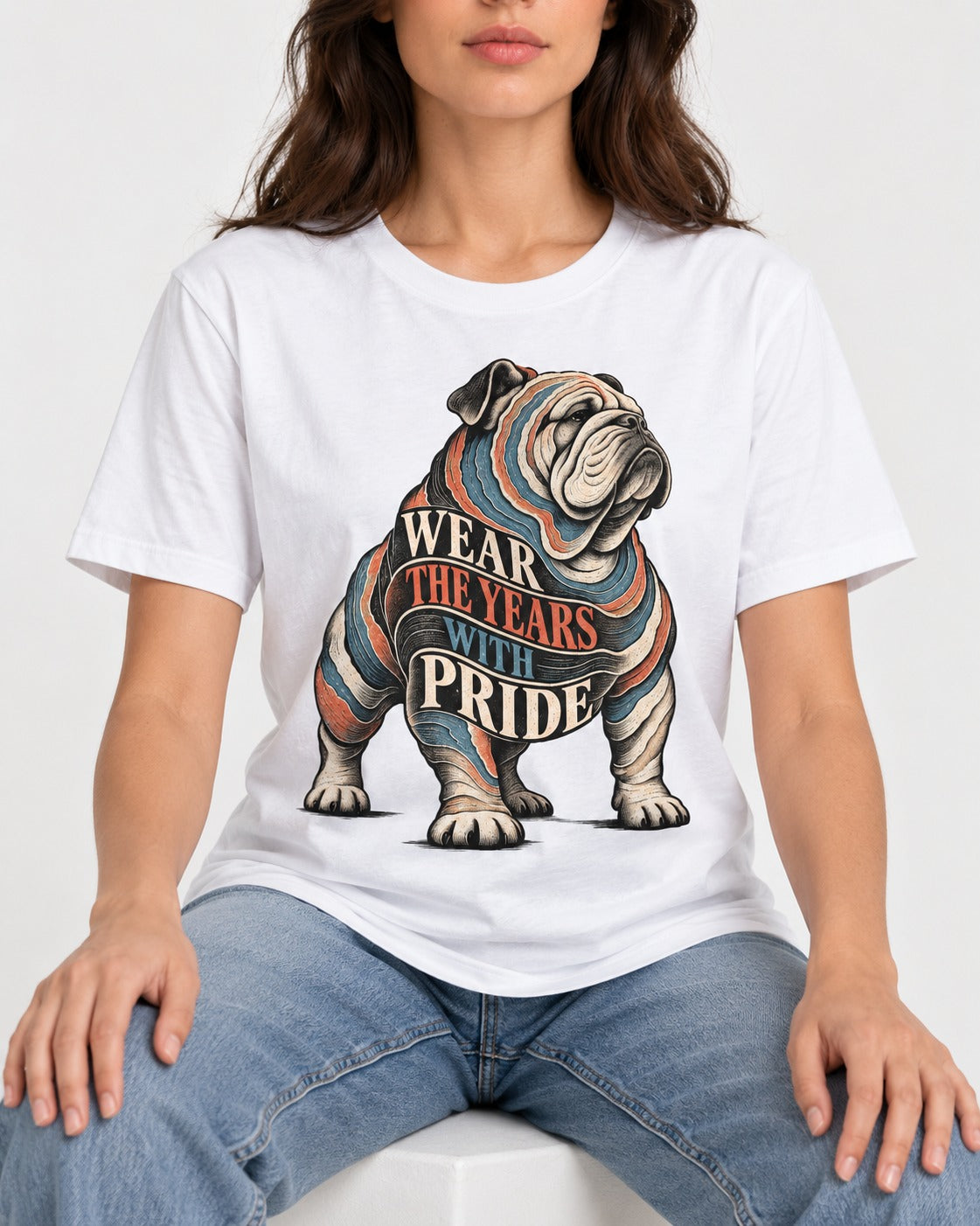 English Bulldog Wear the Years T-Shirt in White, worn by a seated model