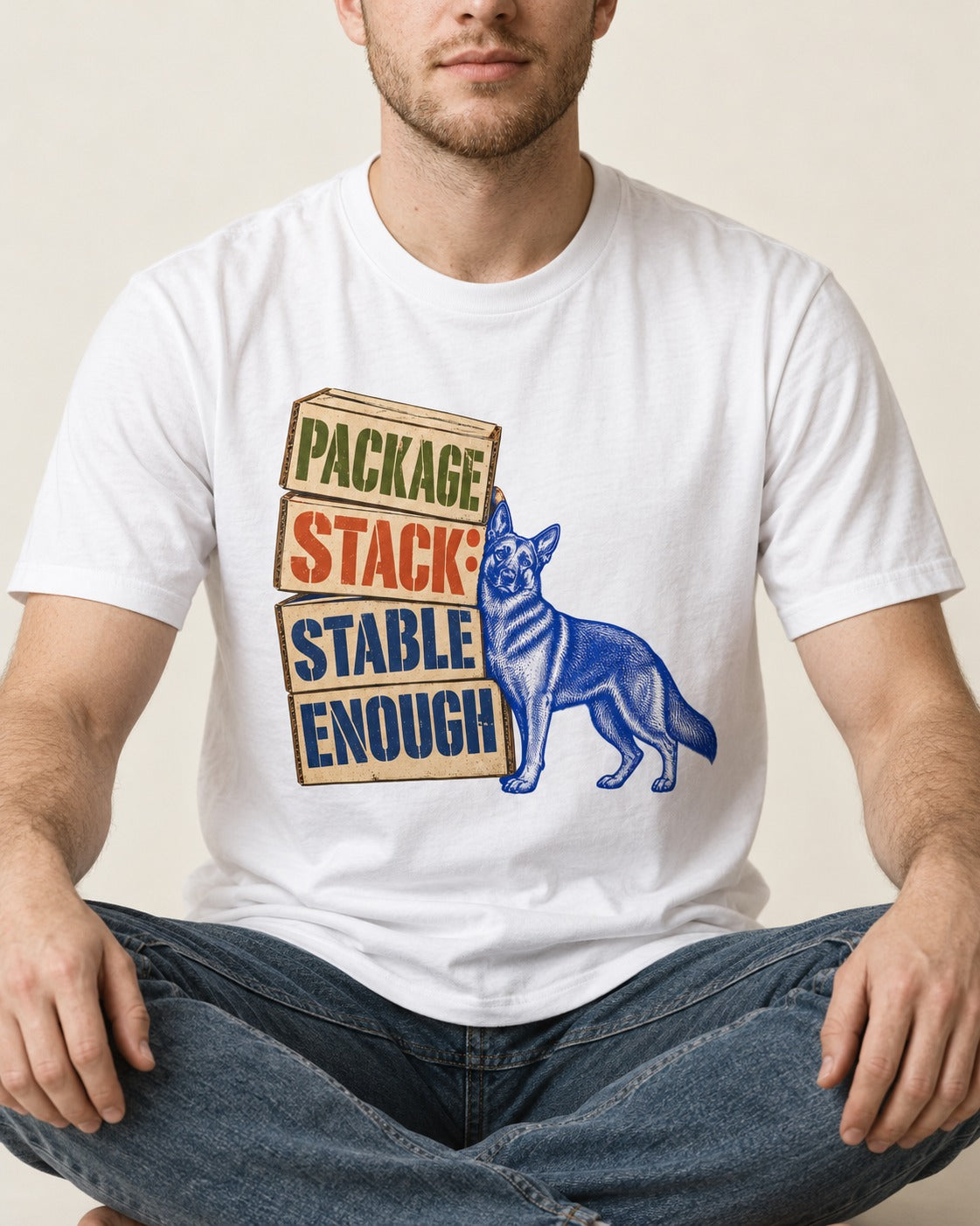 Package Stack Stable Enough German Shepherd Dog T-Shirt in White, worn by a seated model