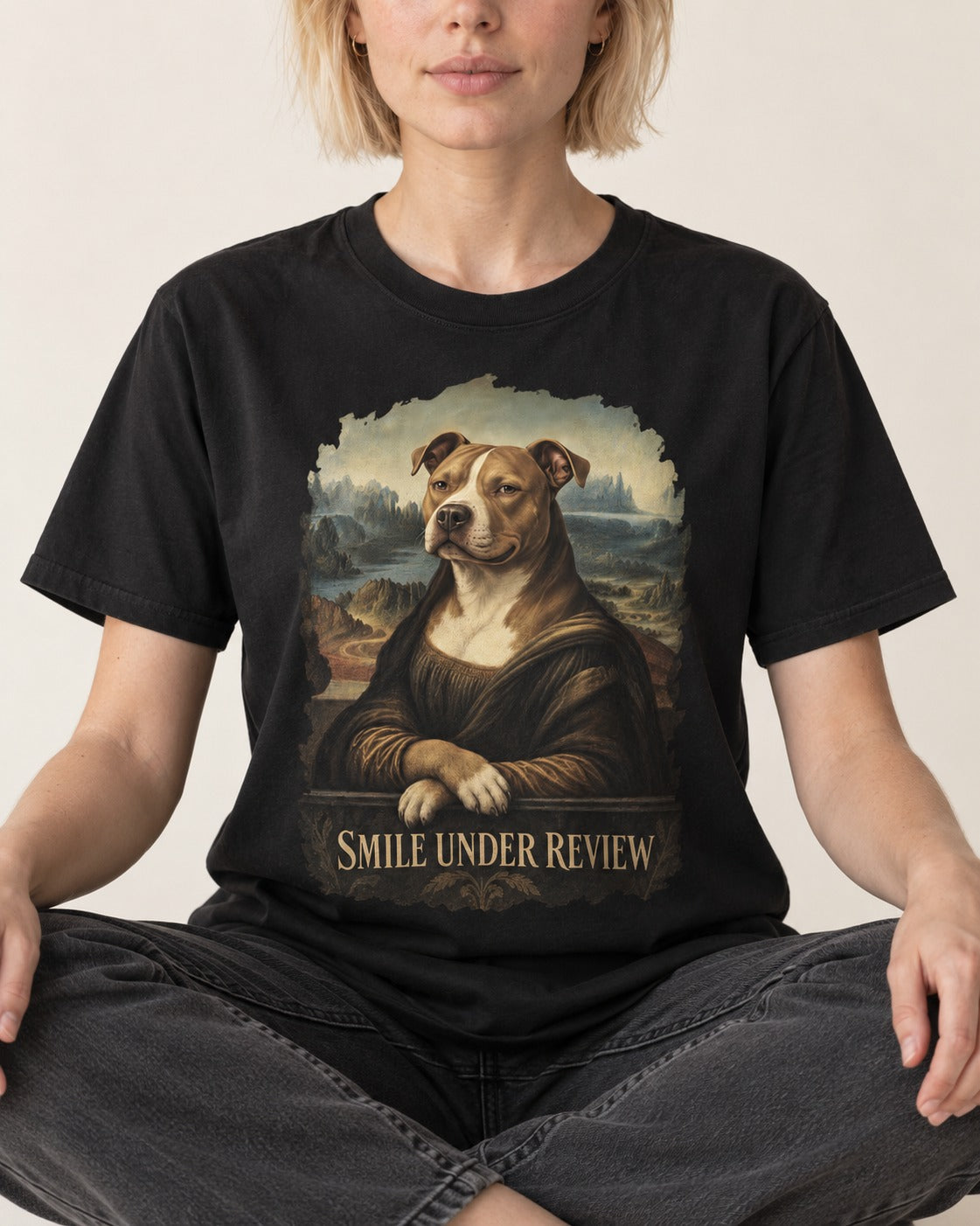 Pitbull Smile Under Review Renaissance Portrait Graphic T-Shirt in Black, worn by a seated model