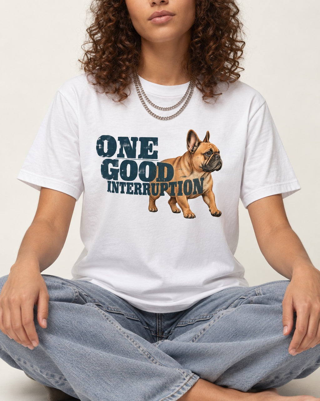 One Good Frenchie Interruption T-Shirt in White, worn by a seated model