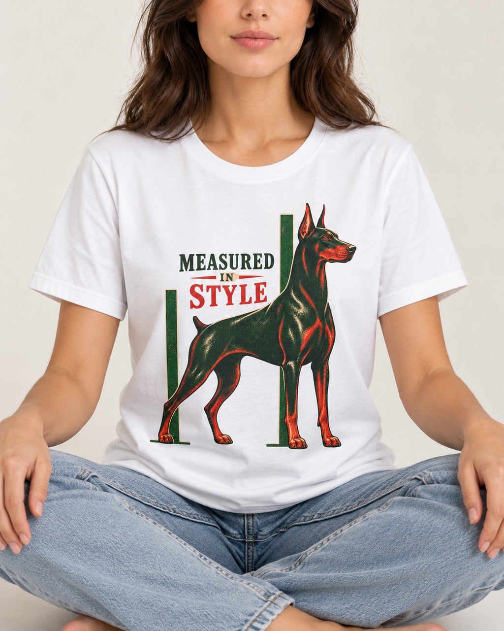 Measured in Doberman T-Shirt in White, worn by a seated model
