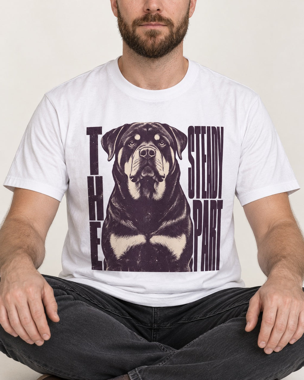 Rottweiler The Steady Part T-Shirt in White, worn by a seated model
