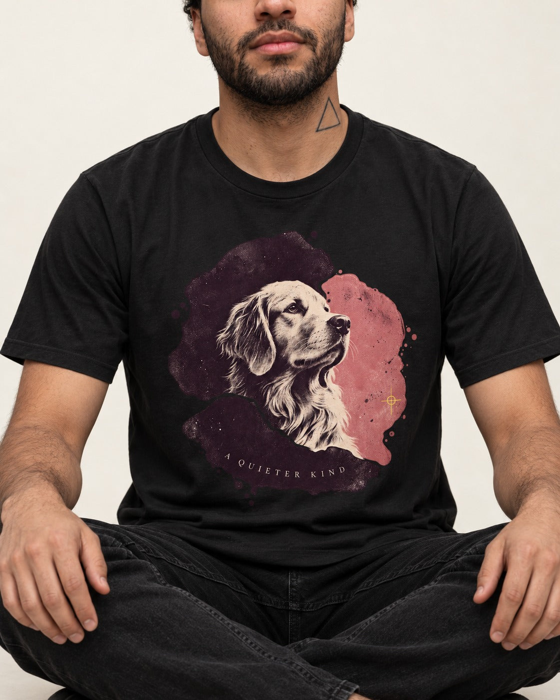 Golden Retriever A Quieter Kind Ink Wash Portrait Graphic T-Shirt in Black, worn by a seated model