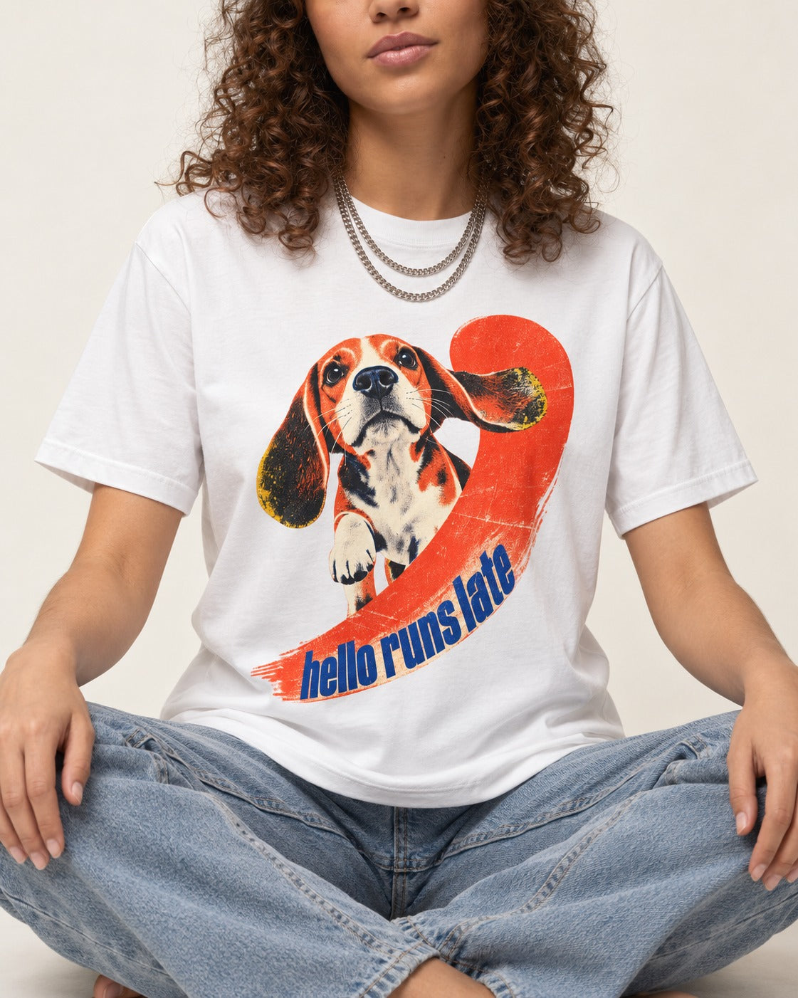 Beagle Hello Runs Late T-Shirt in White, worn by a seated model