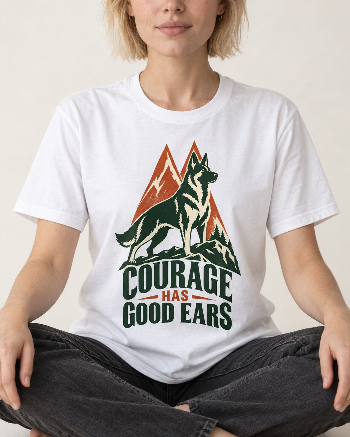 Courage Has Good Ears German Shepherd Dog T-Shirt in White, worn by a seated model