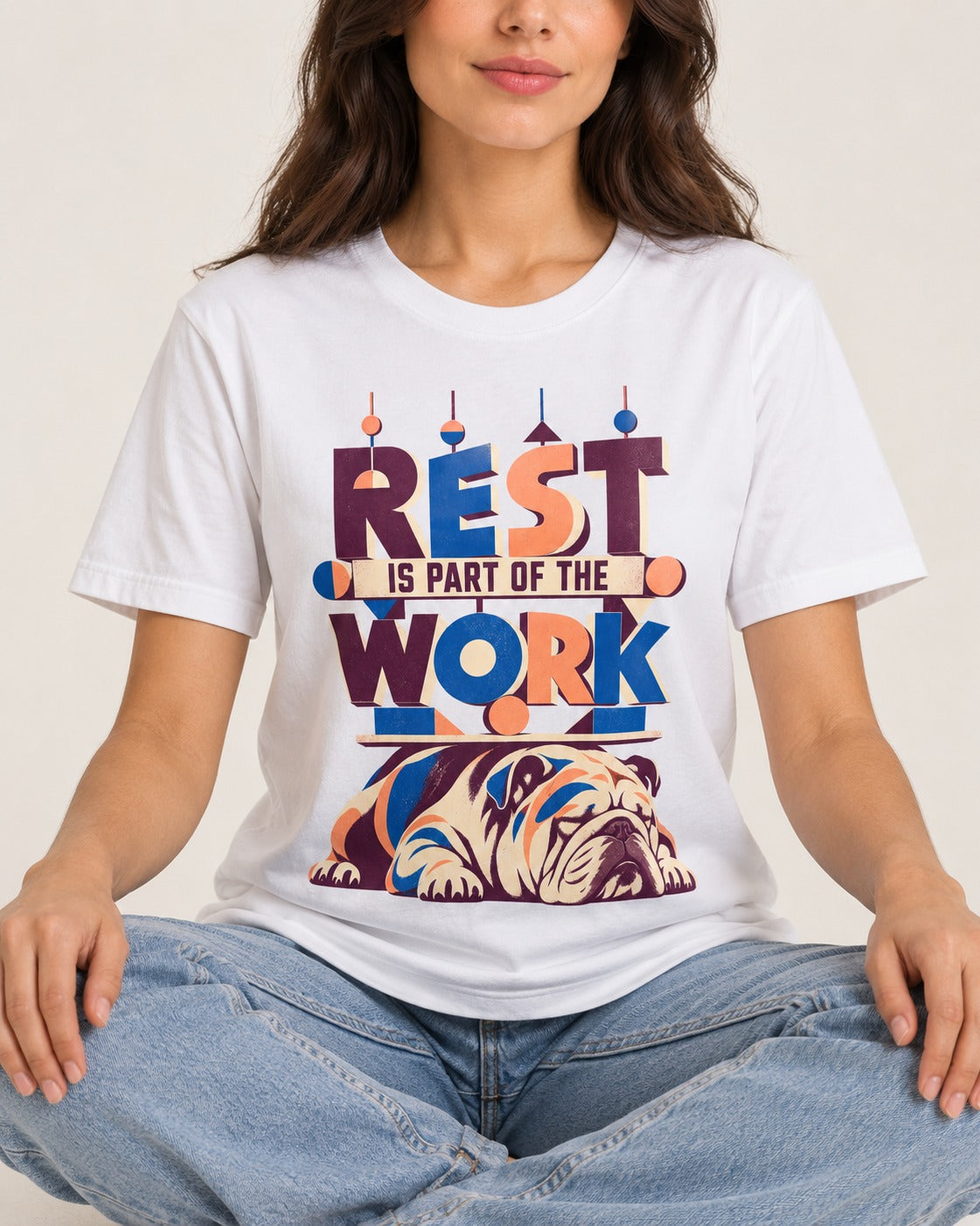 Rest Is Work English Bulldog T-Shirt in White, worn by a seated model