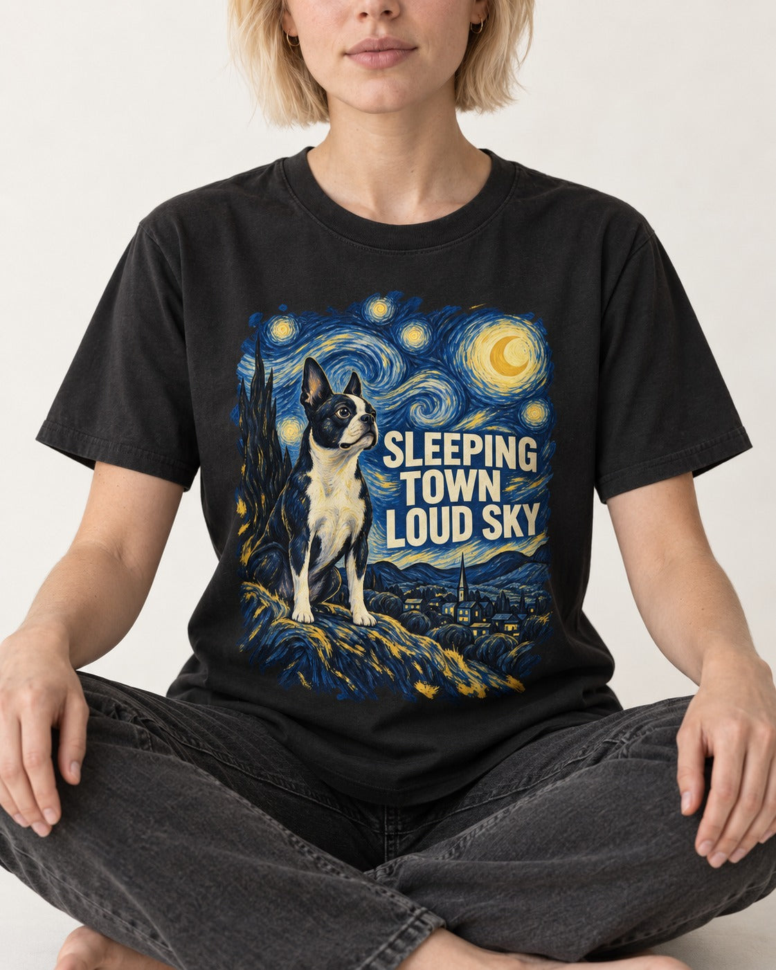 Sleeping Town Loud Sky Boston Terrier Starry Night T-Shirt in Black, worn by a seated model