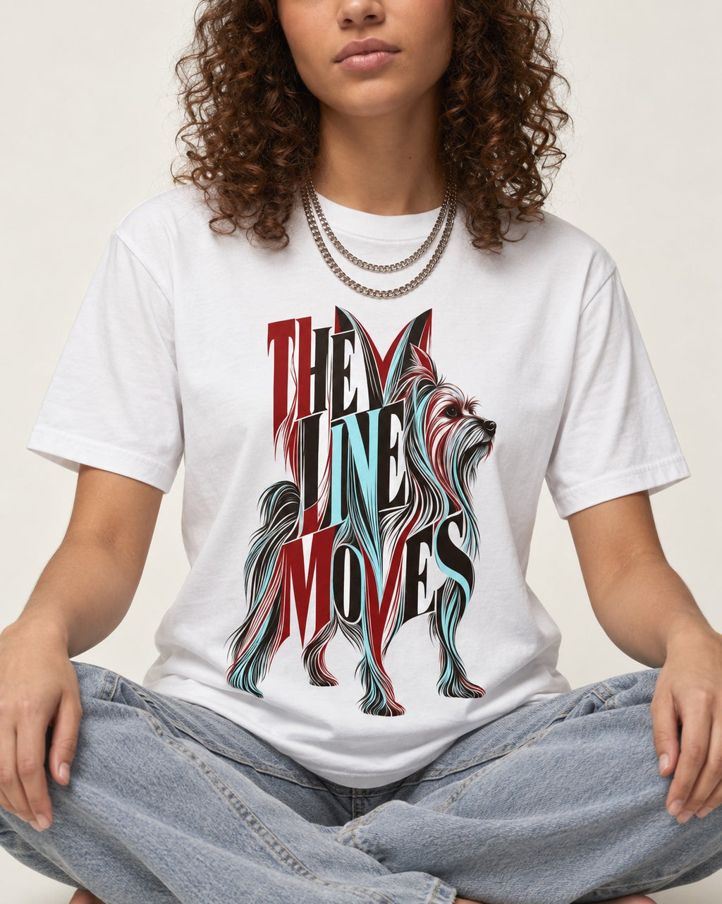 The One Moves Yorkshire Terrier T-Shirt in White, worn by a seated model