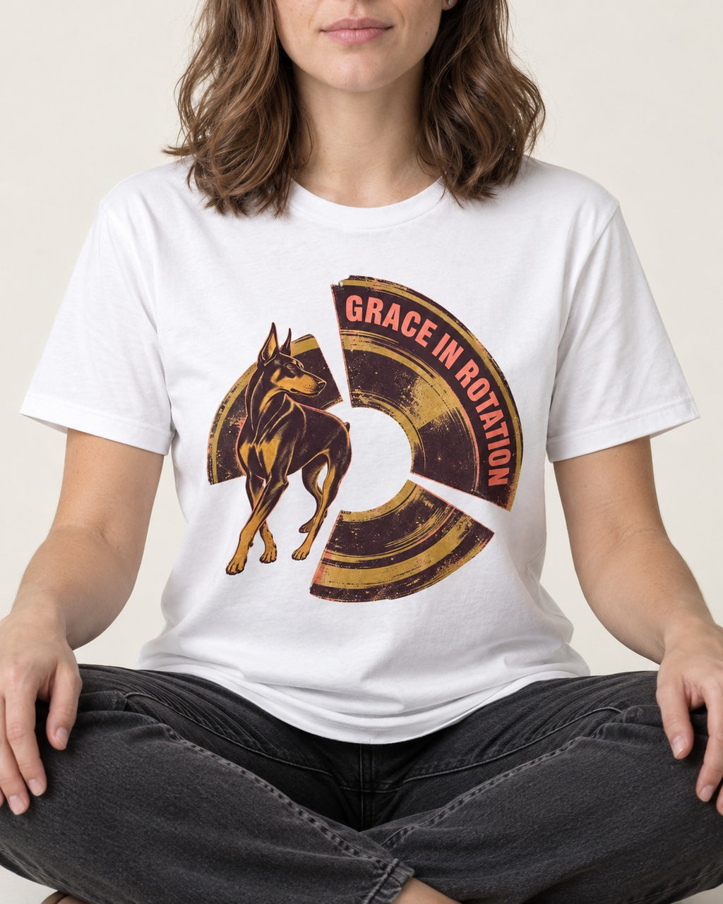 Doberman Grace in Rotation T-Shirt in White, worn by a seated model
