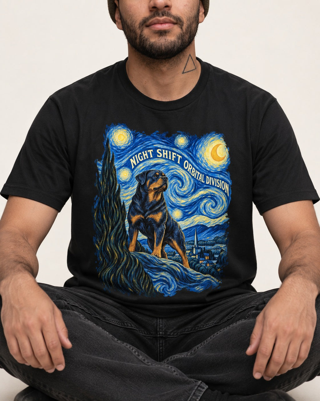 Rottweiler Night Shift Orbital Division Starry Night Graphic T-Shirt in Black, worn by a seated model