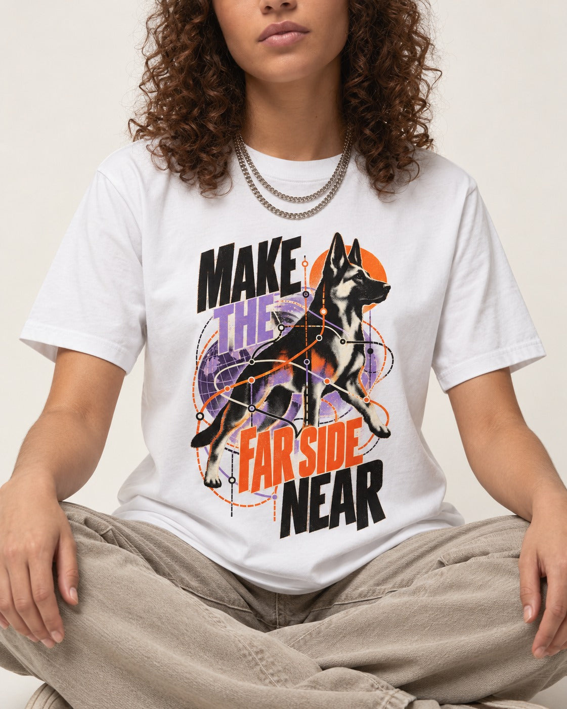 German Shepherd Dog Far Side Near T-Shirt in White, worn by a seated model