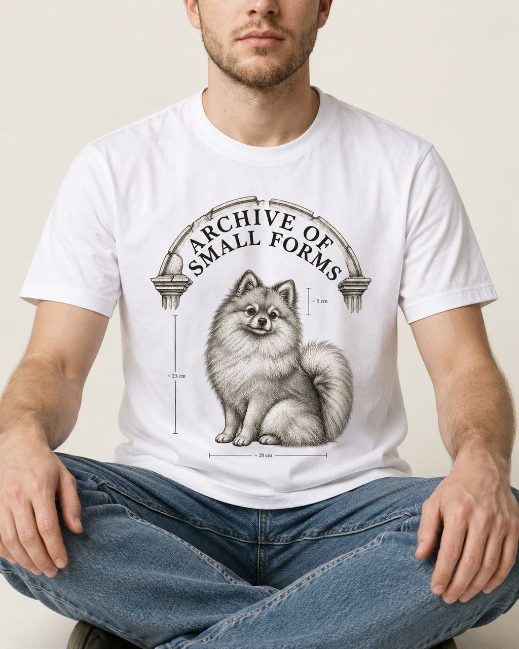 Pomeranian Archive of Small Forms T-Shirt in White, worn by a seated model