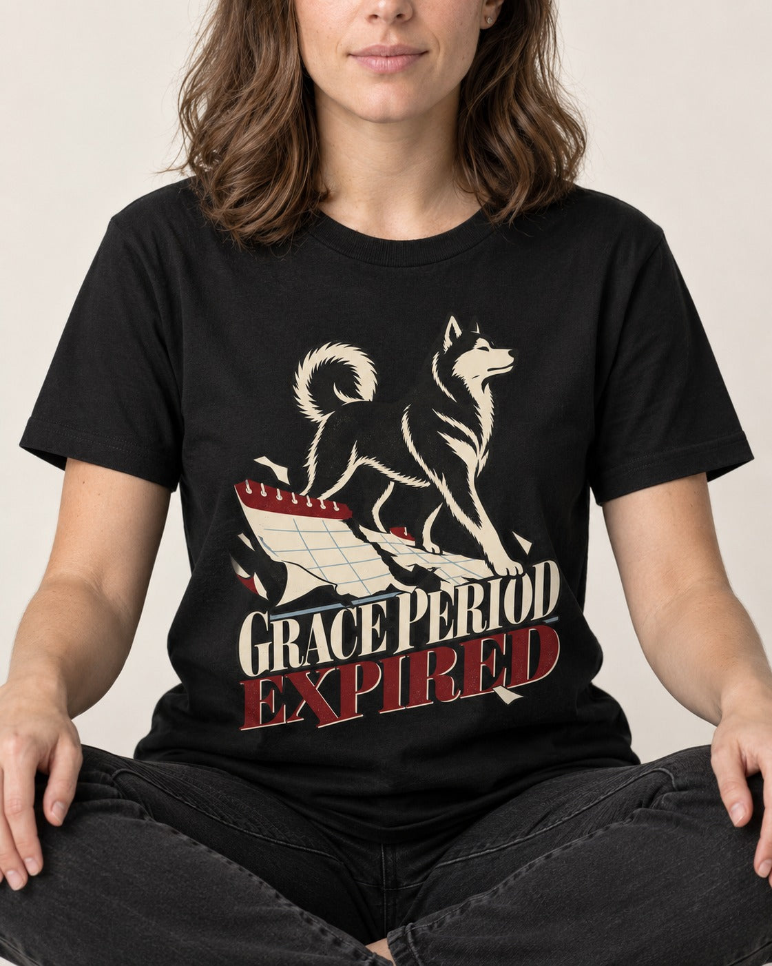 Husky Grace Period Expired Torn Calendar Graphic T-Shirt in Black, worn by a seated model
