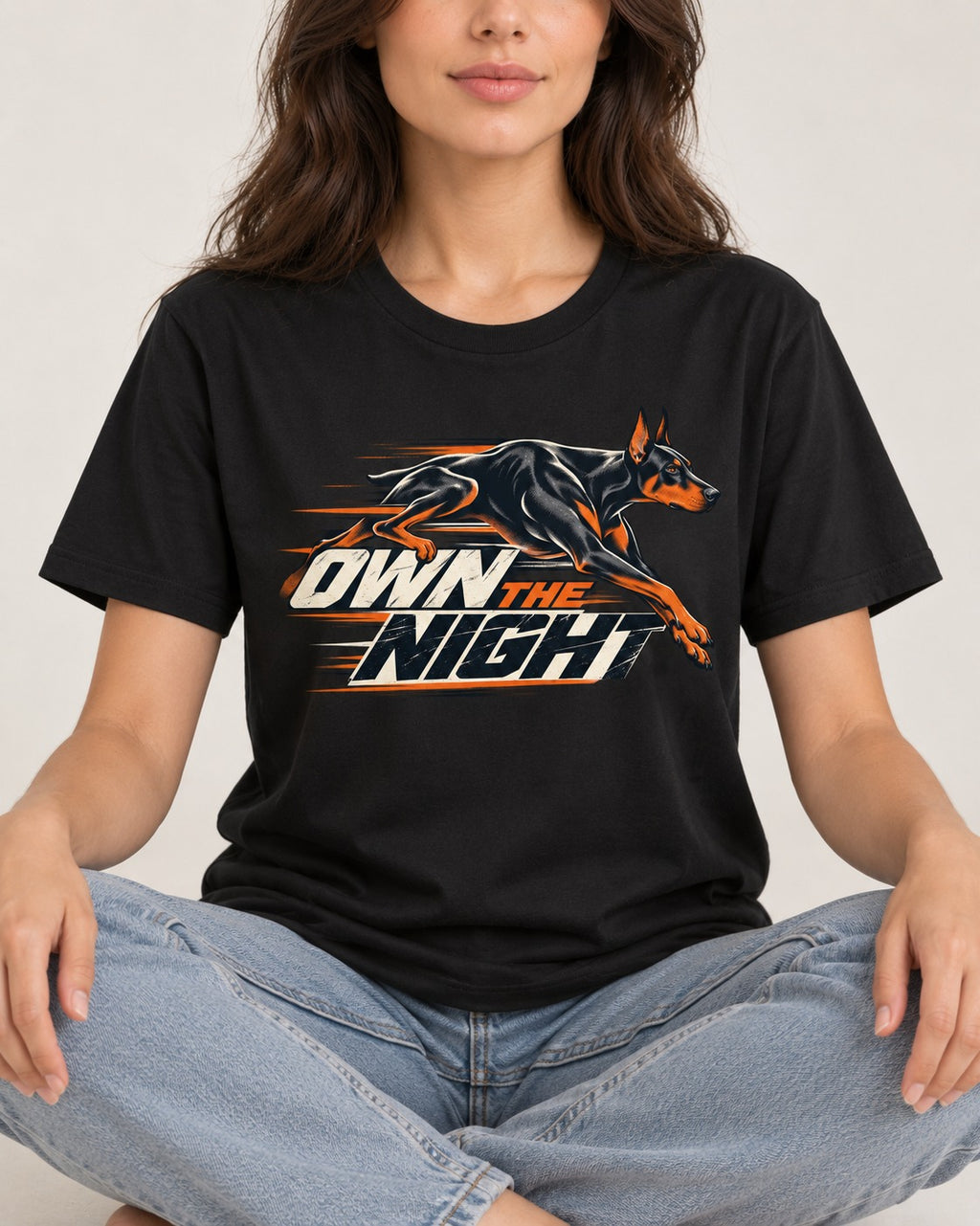 Doberman Own the Night Speed Graphic T-Shirt in Black, worn by a seated model