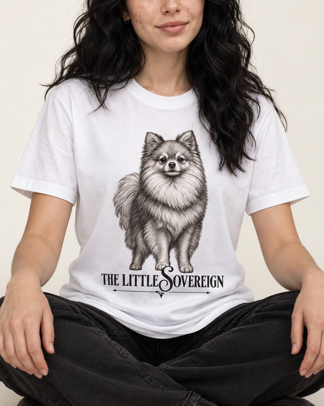The Little Sovereign Pomeranian T-Shirt in White, worn by a seated model