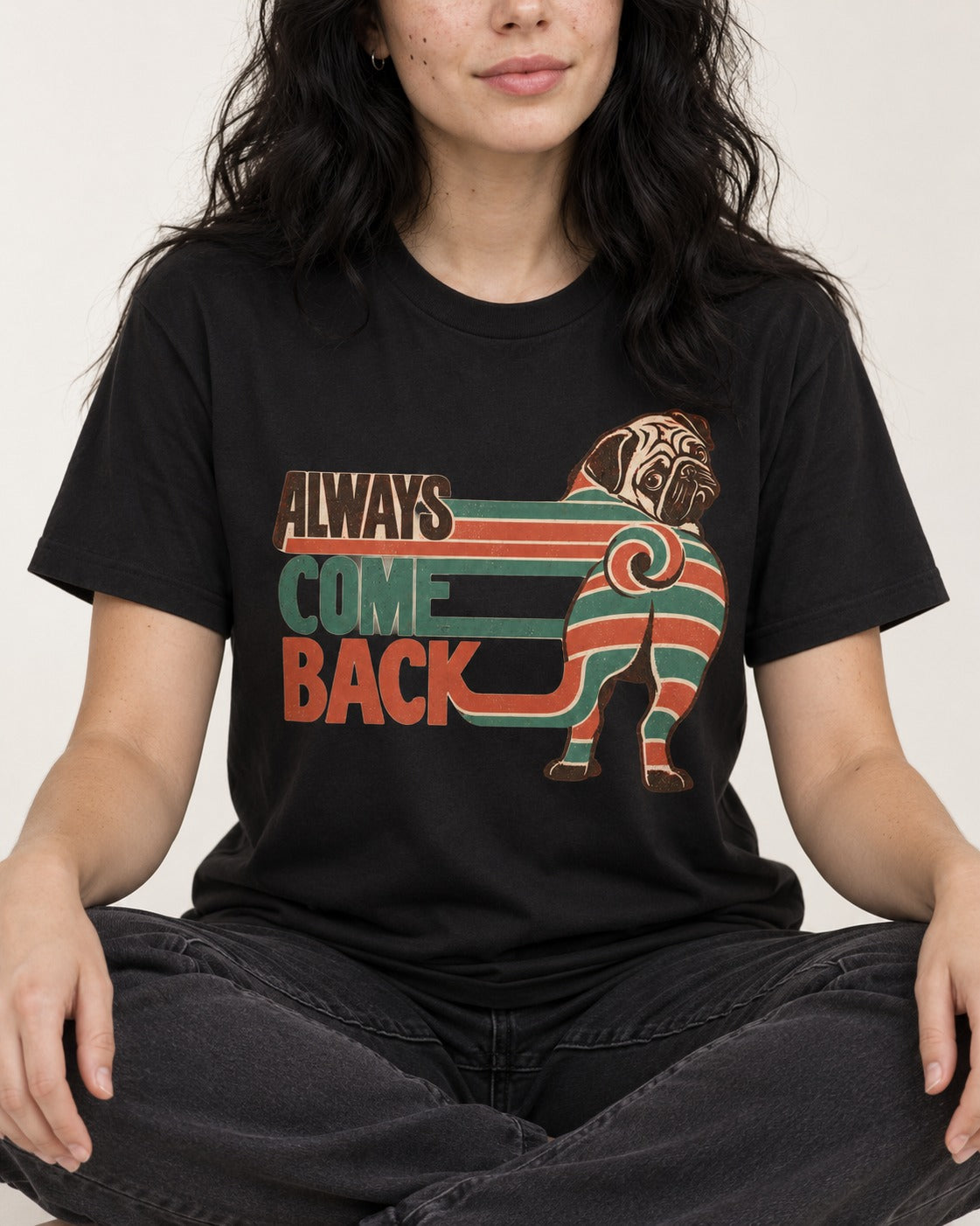 Pug Always Come Back Striped Body Graphic T-Shirt in Black, worn by a seated model