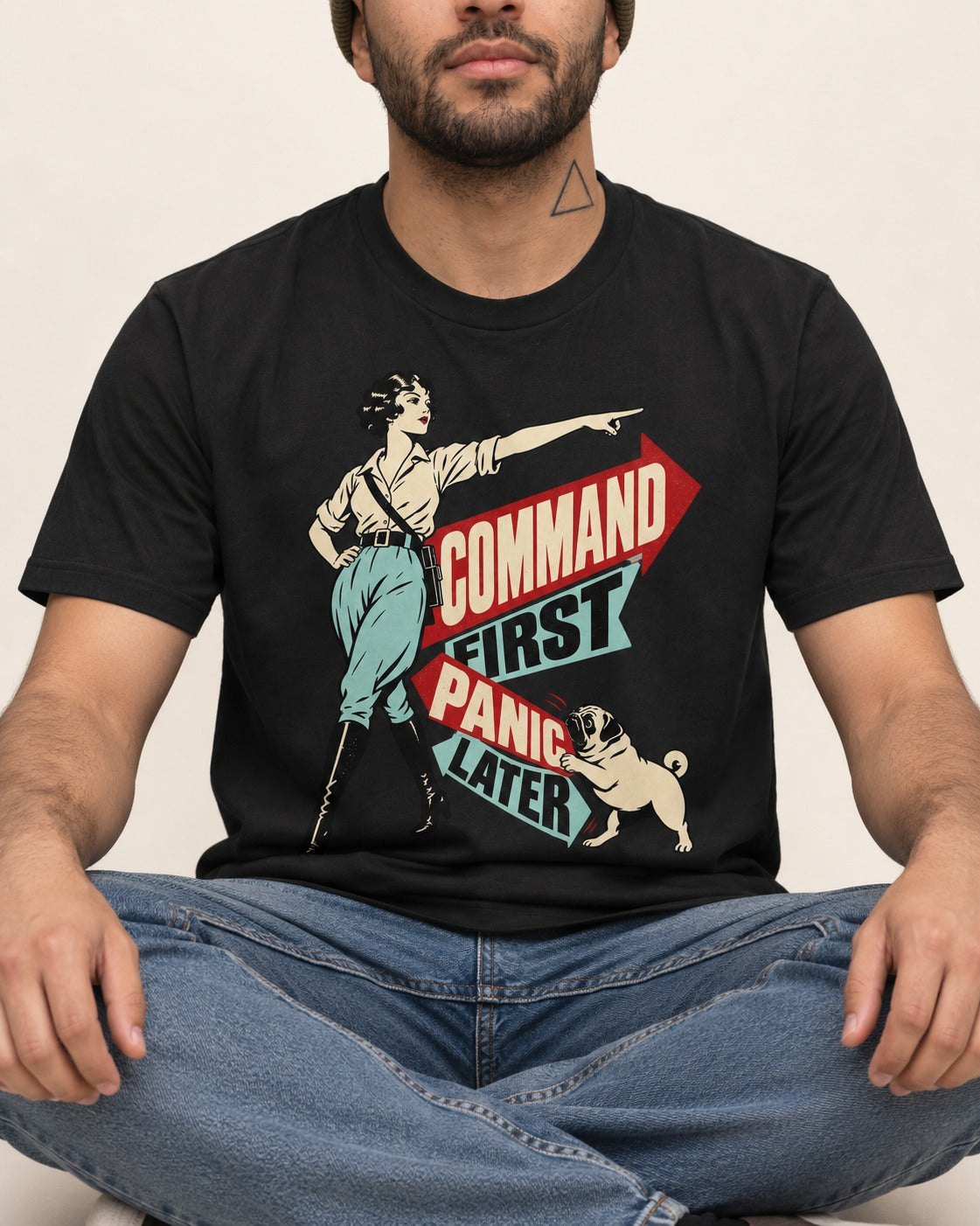 Pug Command First Panic Later Directional Graphic T-Shirt in Black, worn by a seated model