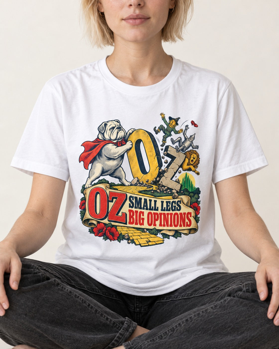 English Bulldog Small Legs Big Opinions T-Shirt in White, worn by a seated model