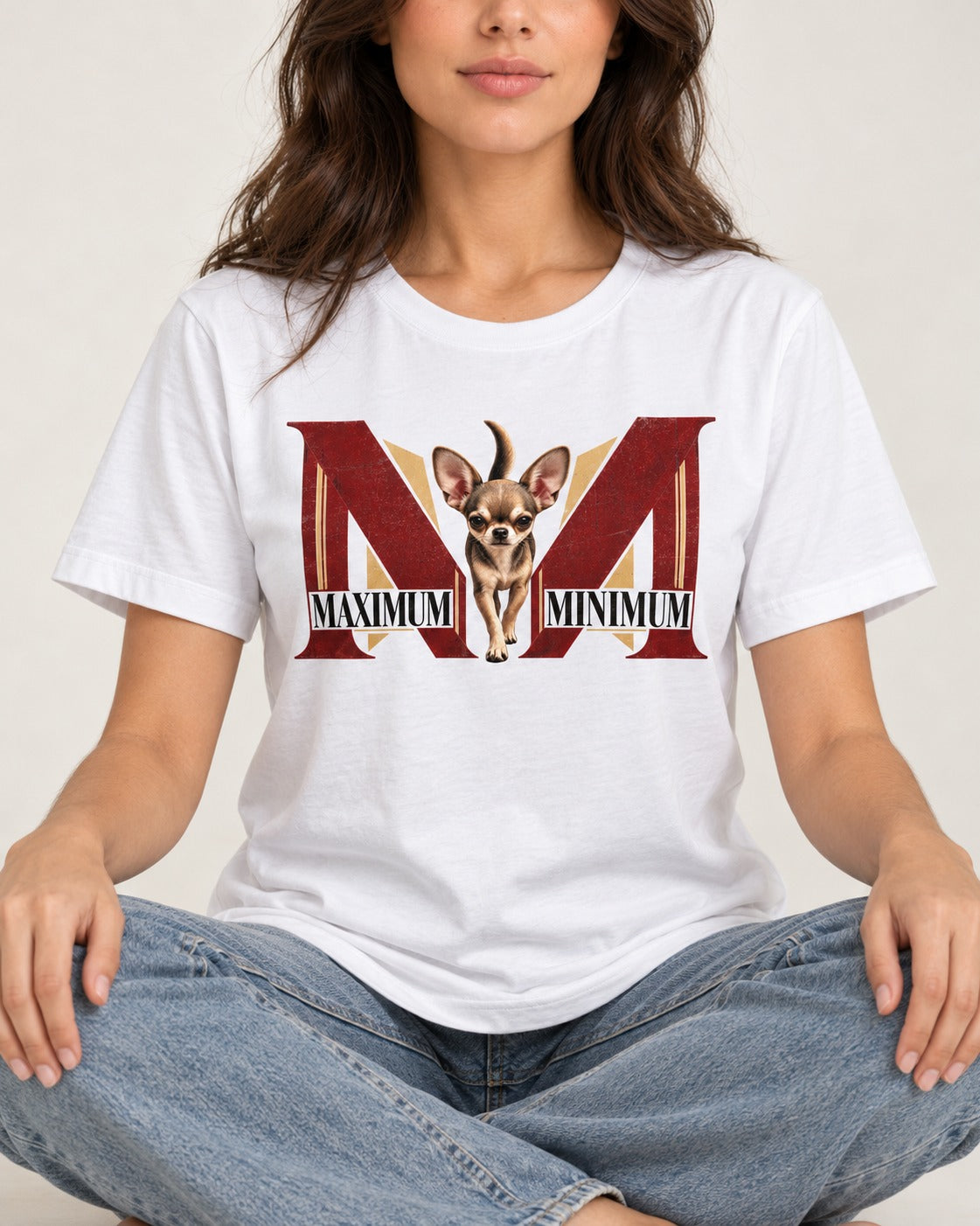 Maximum Minimum Chihuahua T-Shirt in White, worn by a seated model