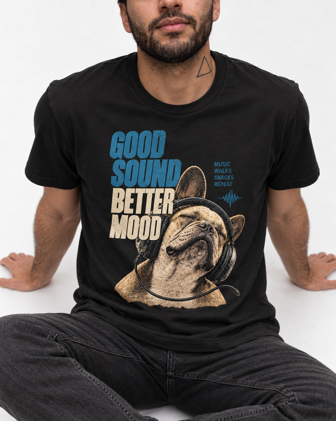 Frenchie Good Sound Better Mood Headphones Graphic T-Shirt in Black, worn by a seated model