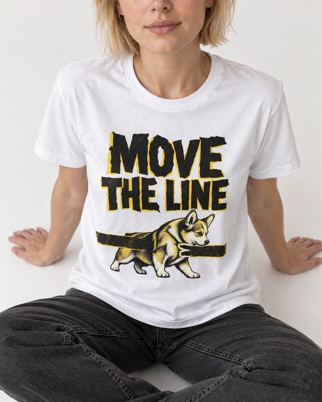 Corgi Move the Line T-Shirt in White, worn by a seated model