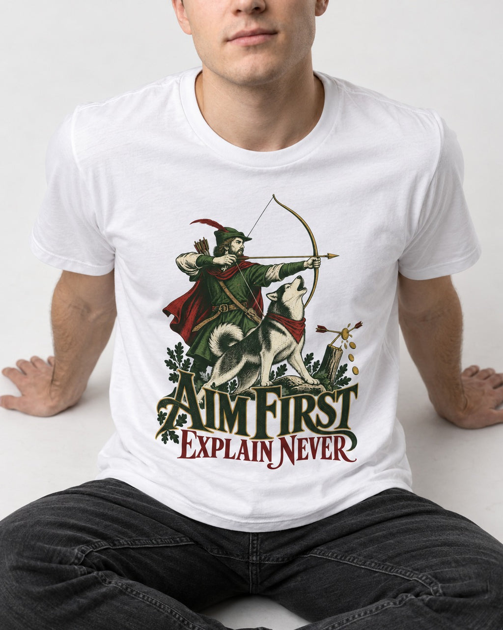 Husky Aim First Explain Never T-Shirt in White, worn by a seated model