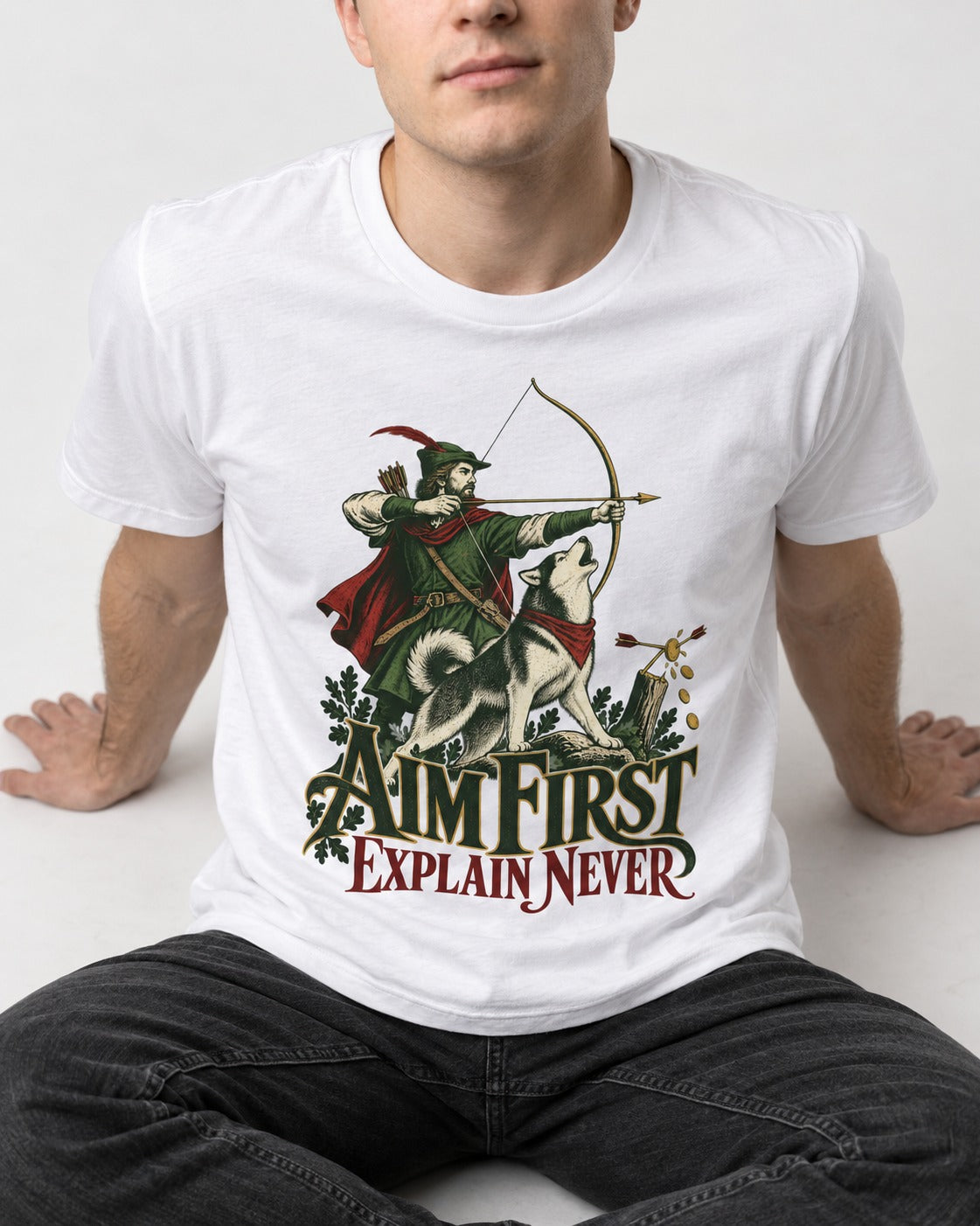 Husky Aim First Explain Never T-Shirt in White, worn by a seated model