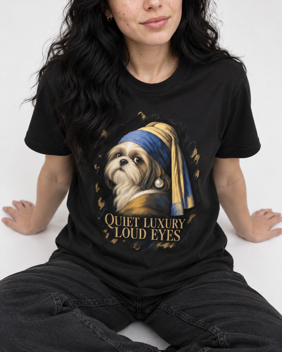 Shih Tzu Quiet Luxury Loud Eyes Pearl Portrait Graphic T-Shirt in Black, worn by a seated model