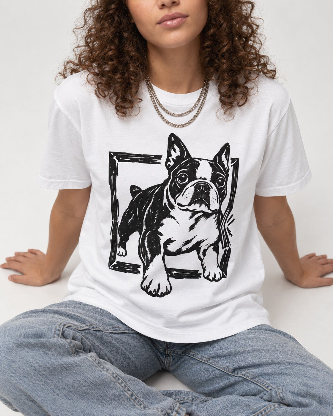 Boston Terrier Unstoppable T-Shirt in White, worn by a seated model