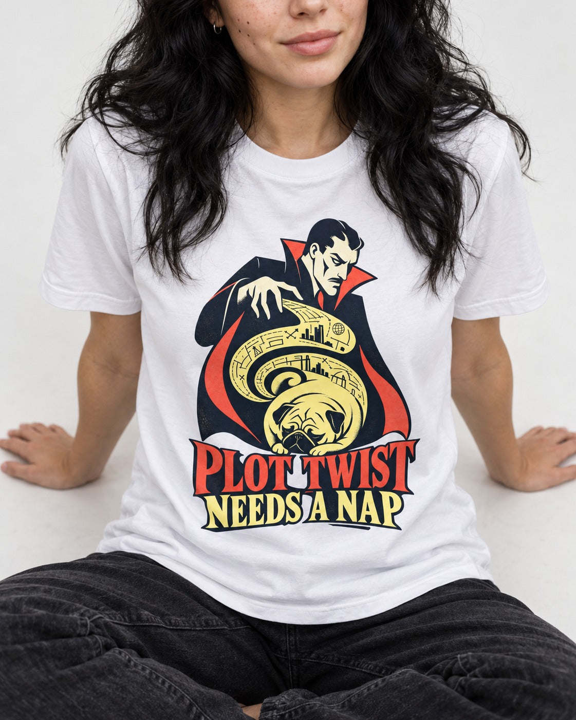 Pug Needs a Nap T-Shirt in White, worn by a seated model