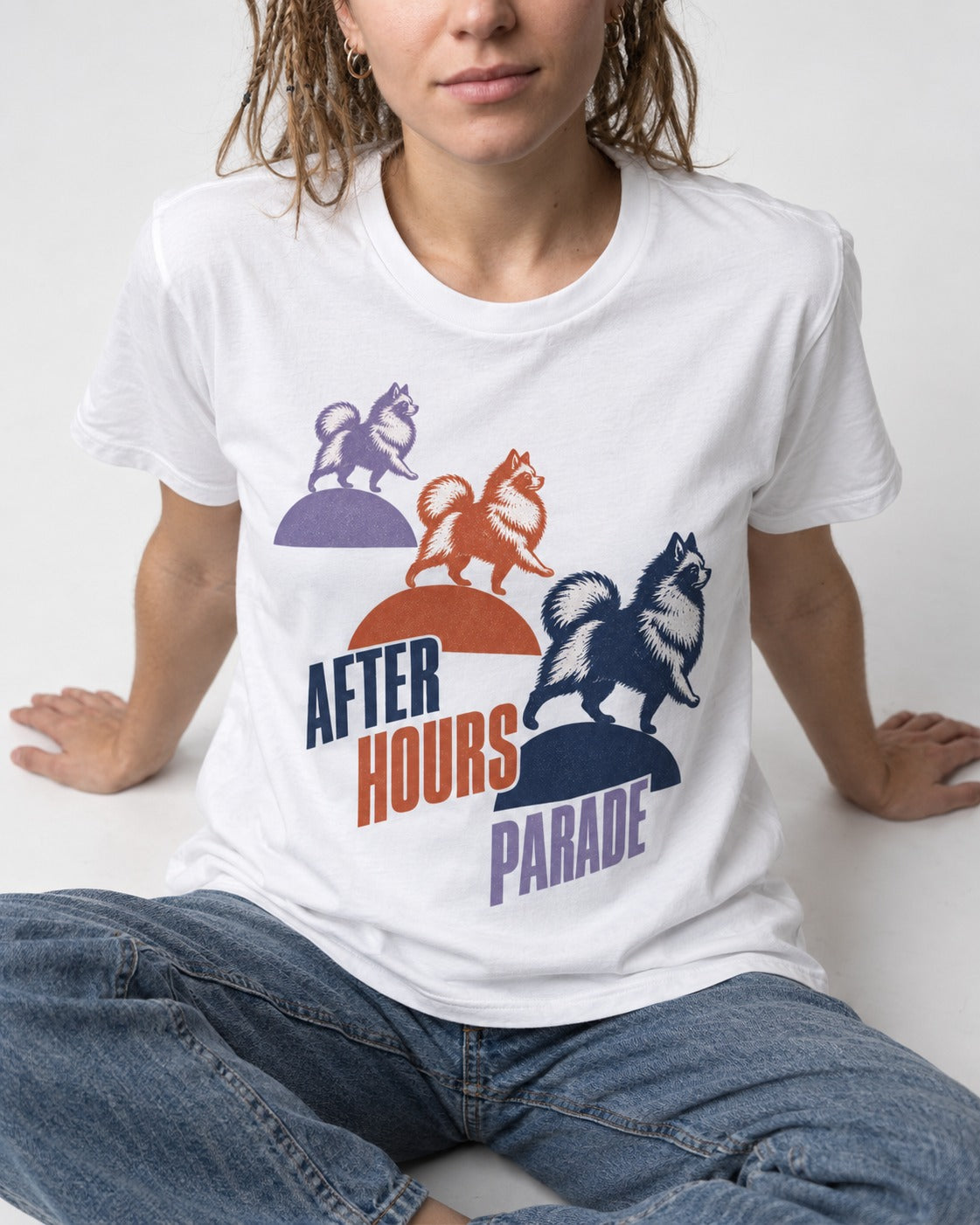 Pomeranian After Hours Parade T-Shirt in White, worn by a seated model