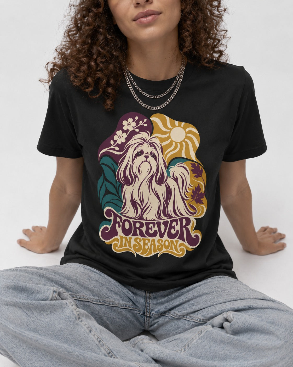 Shih Tzu Forever in Season Botanical Sun Graphic T-Shirt in Black, worn by a seated model