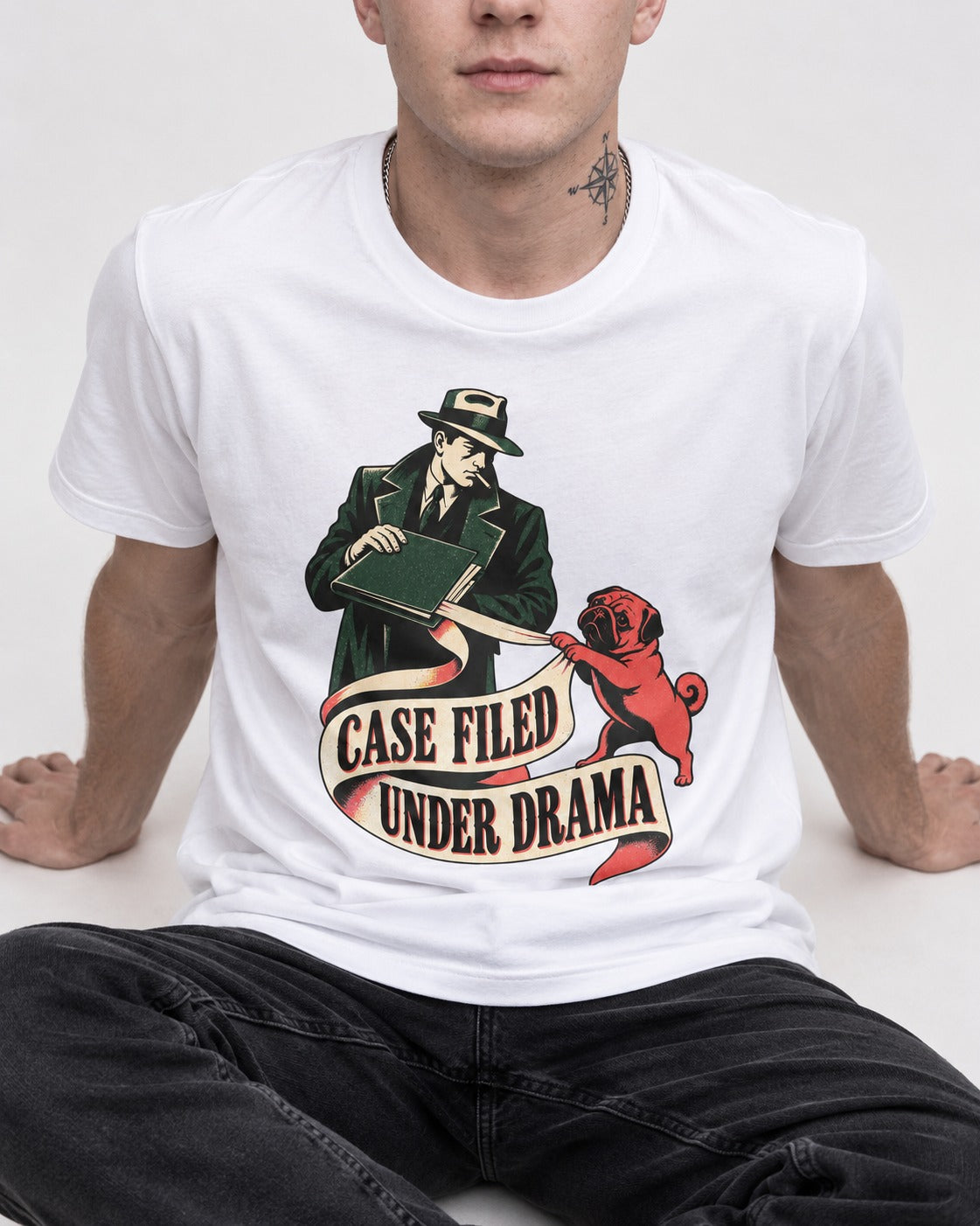 Pug Case Filed Under Drama T-Shirt in White, worn by a seated model