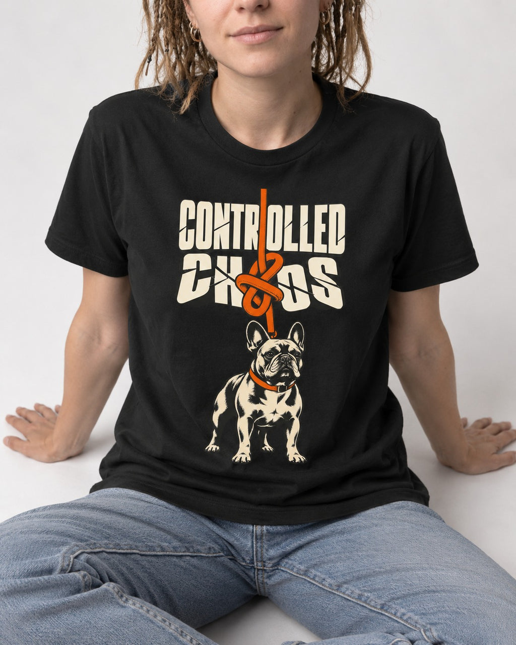 Frenchie Controlled Chaos Leash Knot Graphic T-Shirt in Black, worn by a seated model