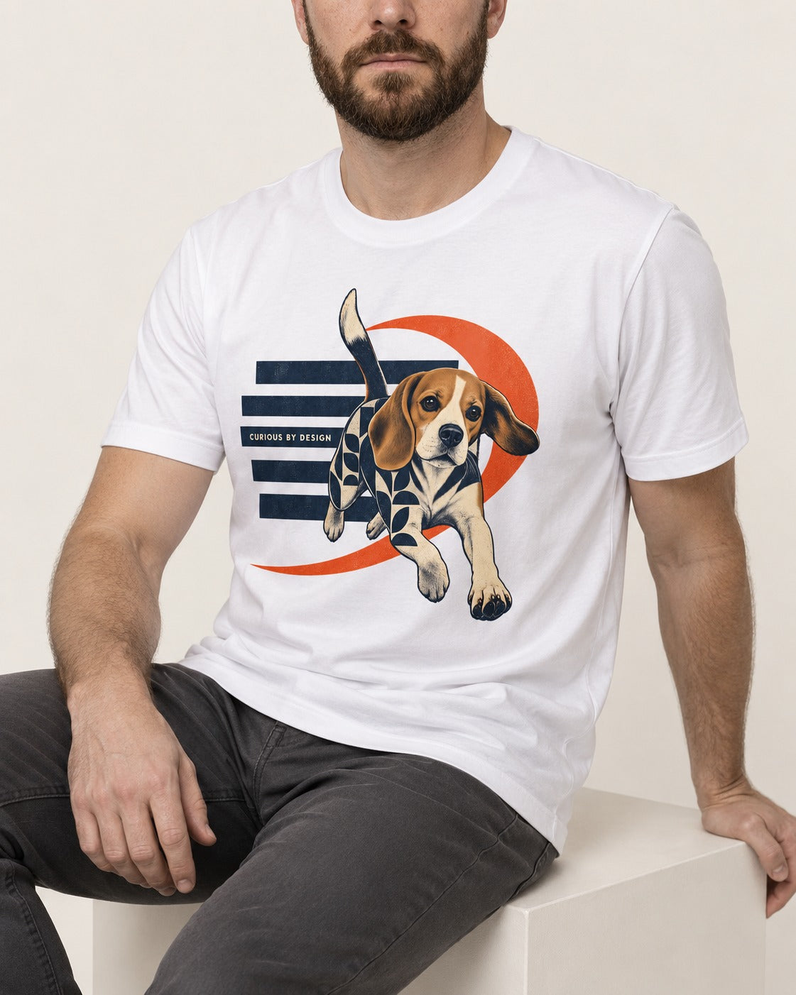 Beagle Born Curious T-Shirt in White, worn by a seated model