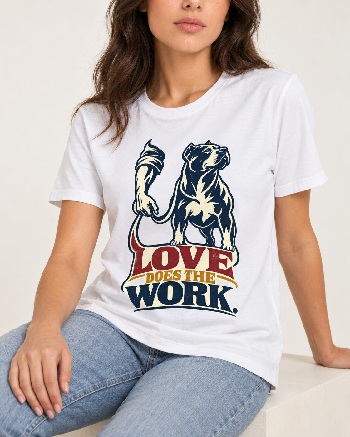 Pitbull Love Does the Work T-Shirt in White, worn by a seated model