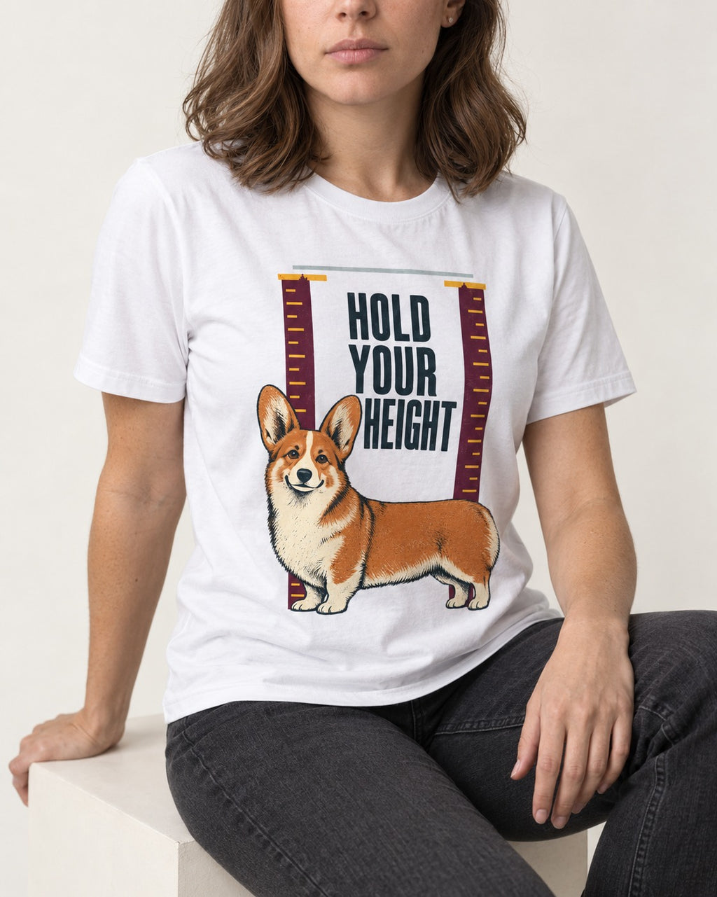 Corgi Hold Your Height T-Shirt in White, worn by a seated model