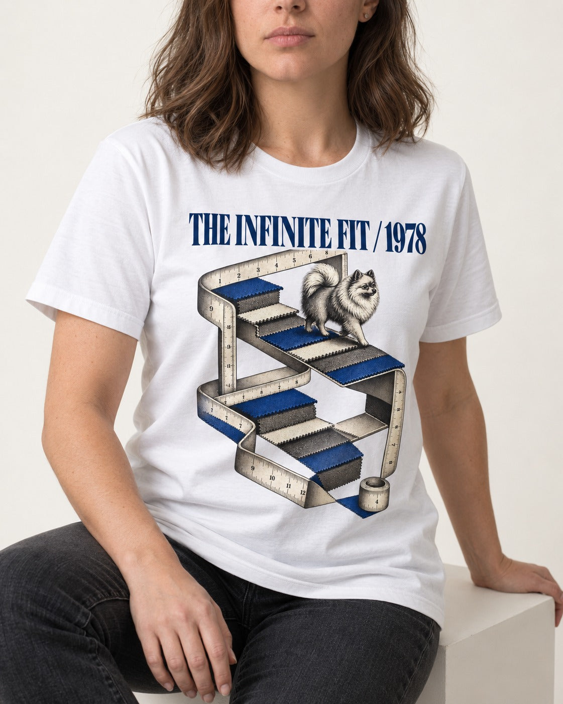 The Infinite Pomeranian Fit T-Shirt in White, worn by a seated model