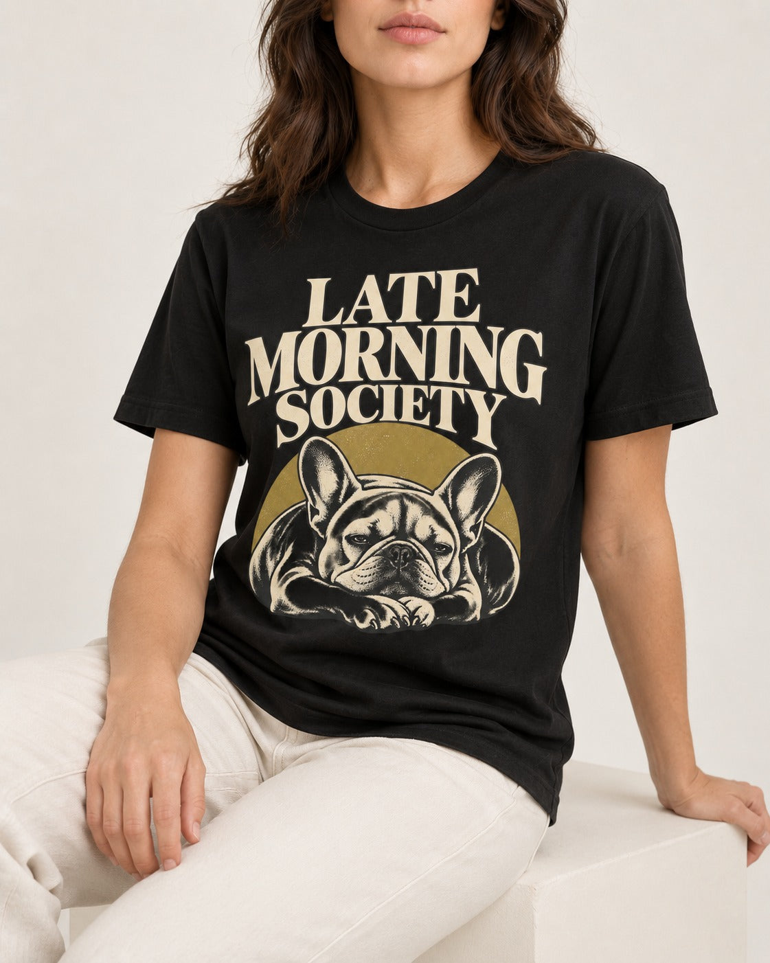 Frenchie Late Morning Society Graphic T-Shirt in Black, worn by a seated model