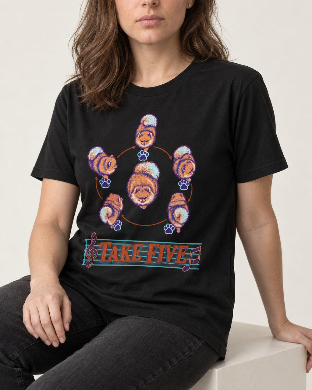 Pomeranian Take Five Choreography Cycle Graphic T-Shirt in Black, worn by a seated model