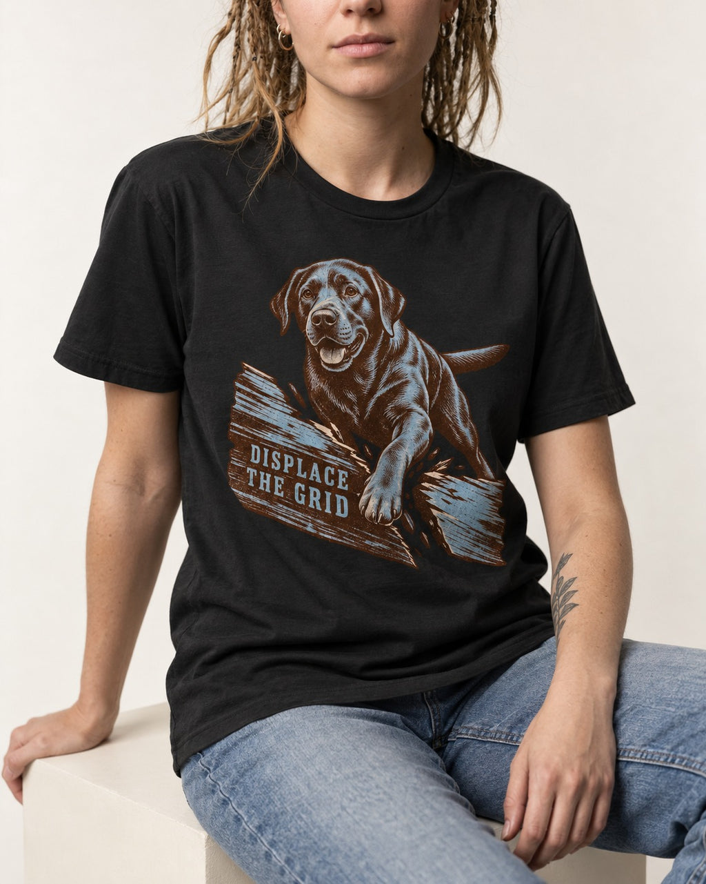 Labrador Retriever Displace the Grid Breaking Plank Graphic T-Shirt in Black, worn by a seated model