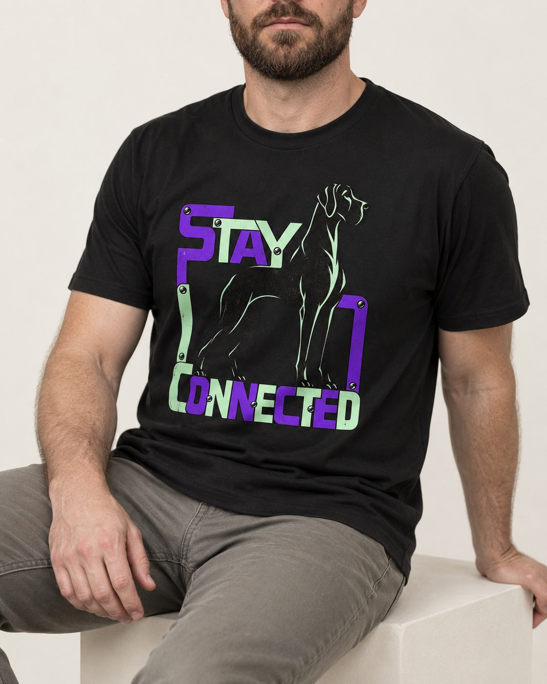 Great Dane Stay Connected Modular Frame Graphic T-Shirt in Black, worn by a seated model