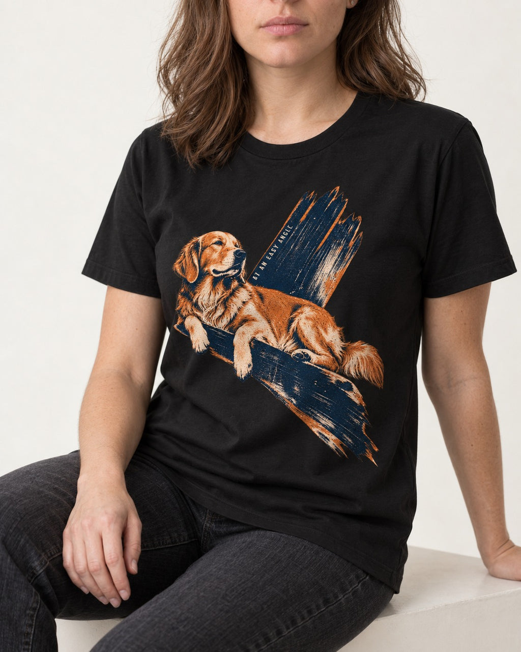 Golden Retriever At an Easy Angle Brushstroke Lounge Graphic T-Shirt in Black, worn by a seated model
