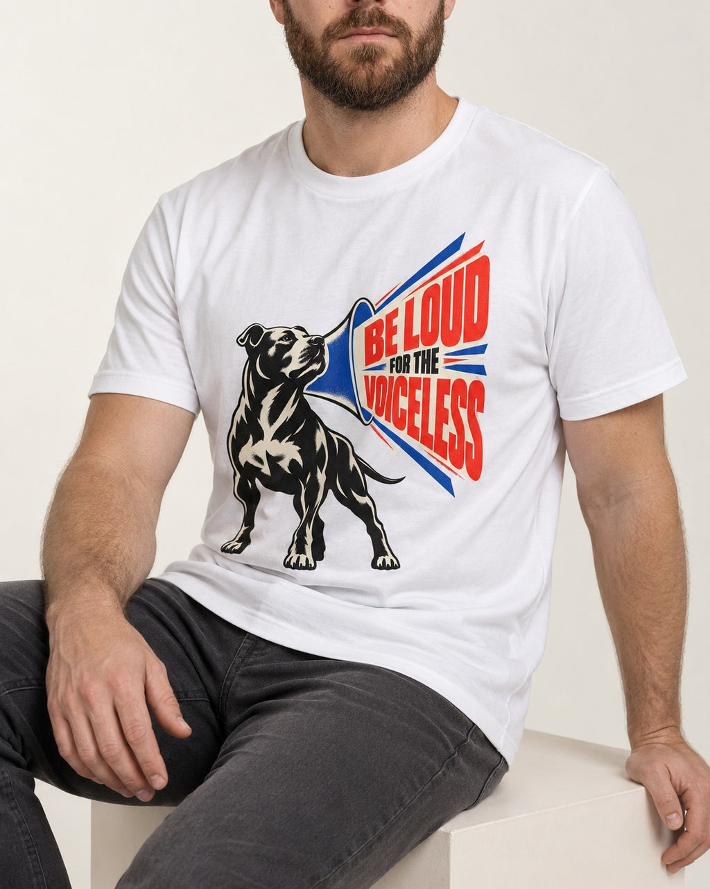Pitbull For the Voiceless T-Shirt in White, worn by a seated model
