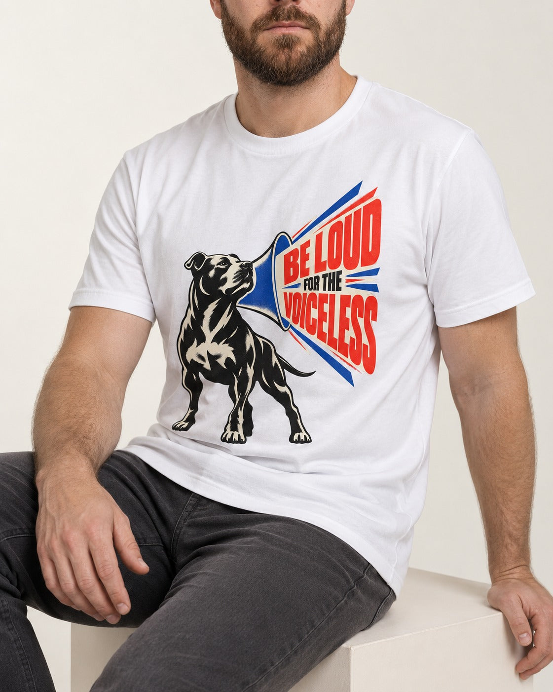 Pitbull For the Voiceless T-Shirt in White, worn by a seated model