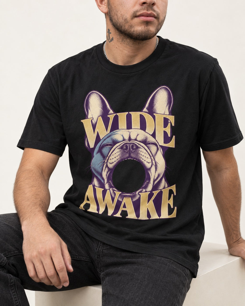 Frenchie Wide Awake Yawn Graphic T-Shirt in Black, worn by a seated model