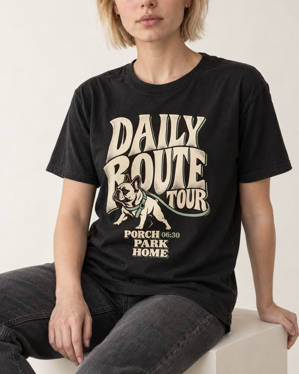 Frenchie Daily Route Tour Graphic T-Shirt in Black, worn by a seated model